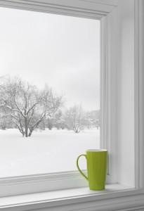 wood window with green cup on windowsill